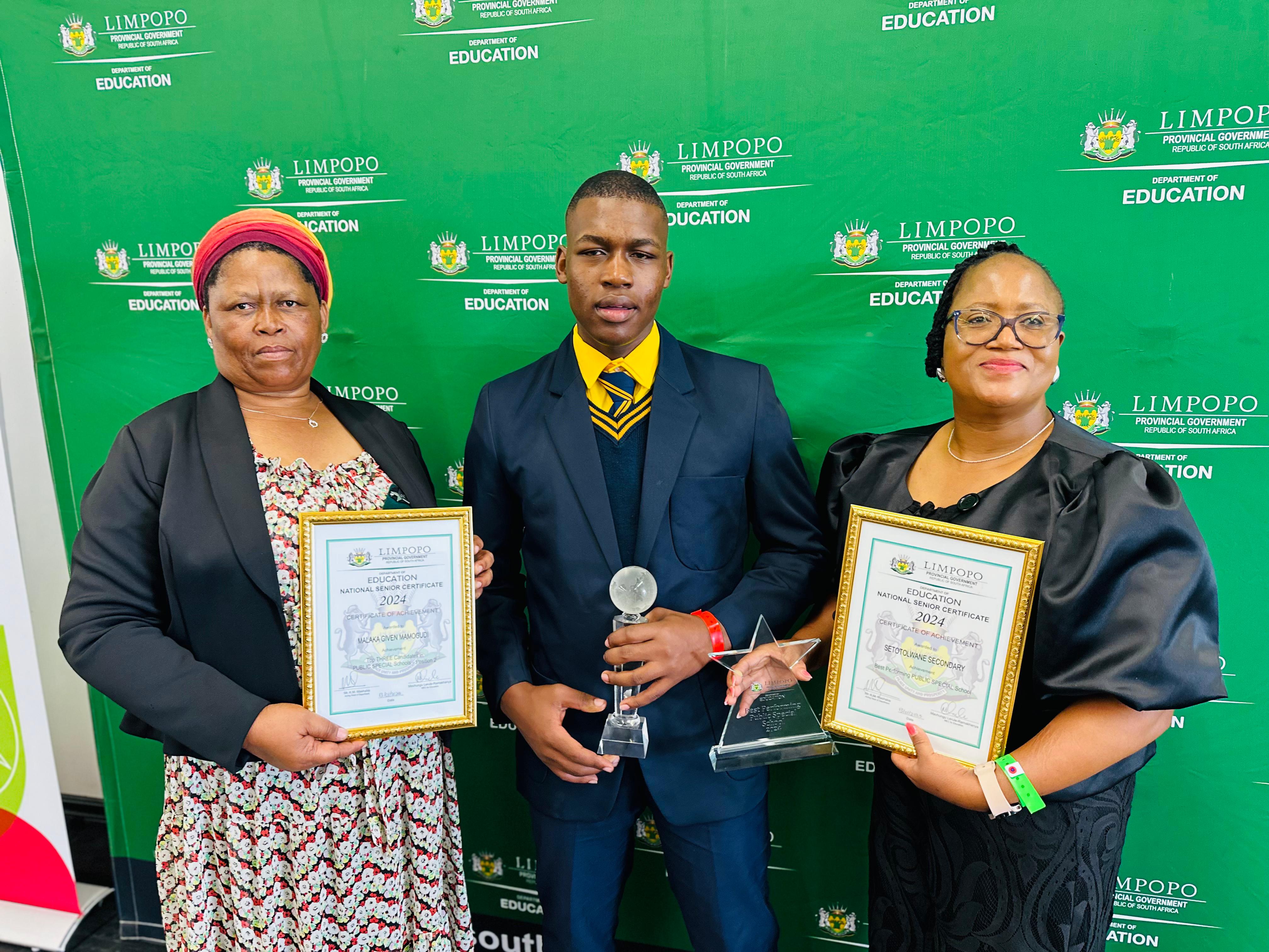 Top matric achiever, Given Malaka, his mom Mrs Thipane Malaka [left] and his former teacher [right] at the Limpopo 2024 matric award ceremony.